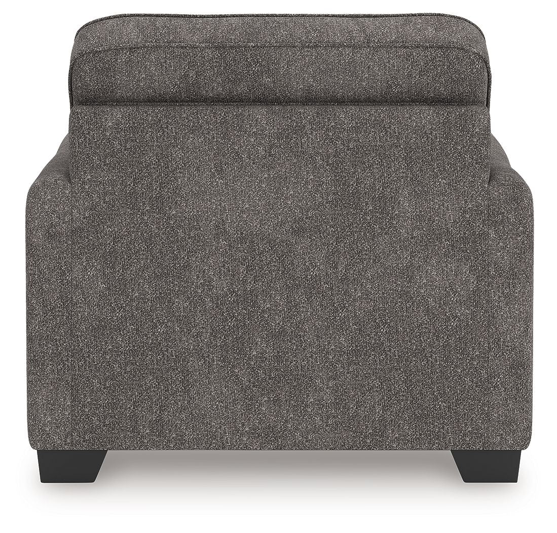 Dark gray upholstered chair and a half back panel with dark legs