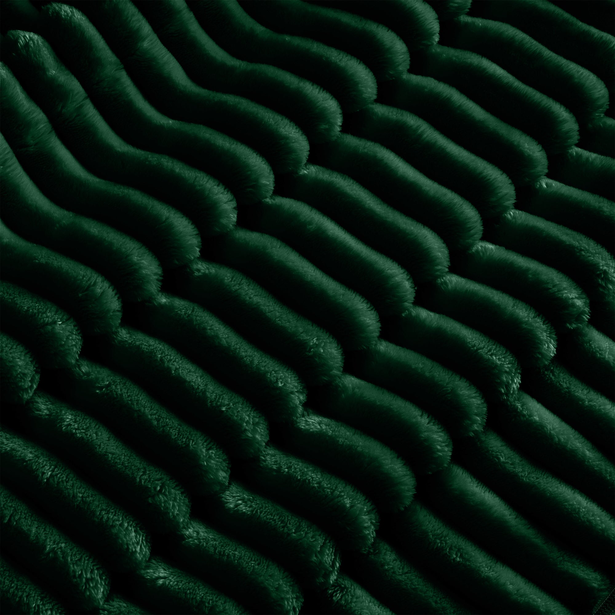 Close-up of green ribbed slipcover fabric on sectional cushions