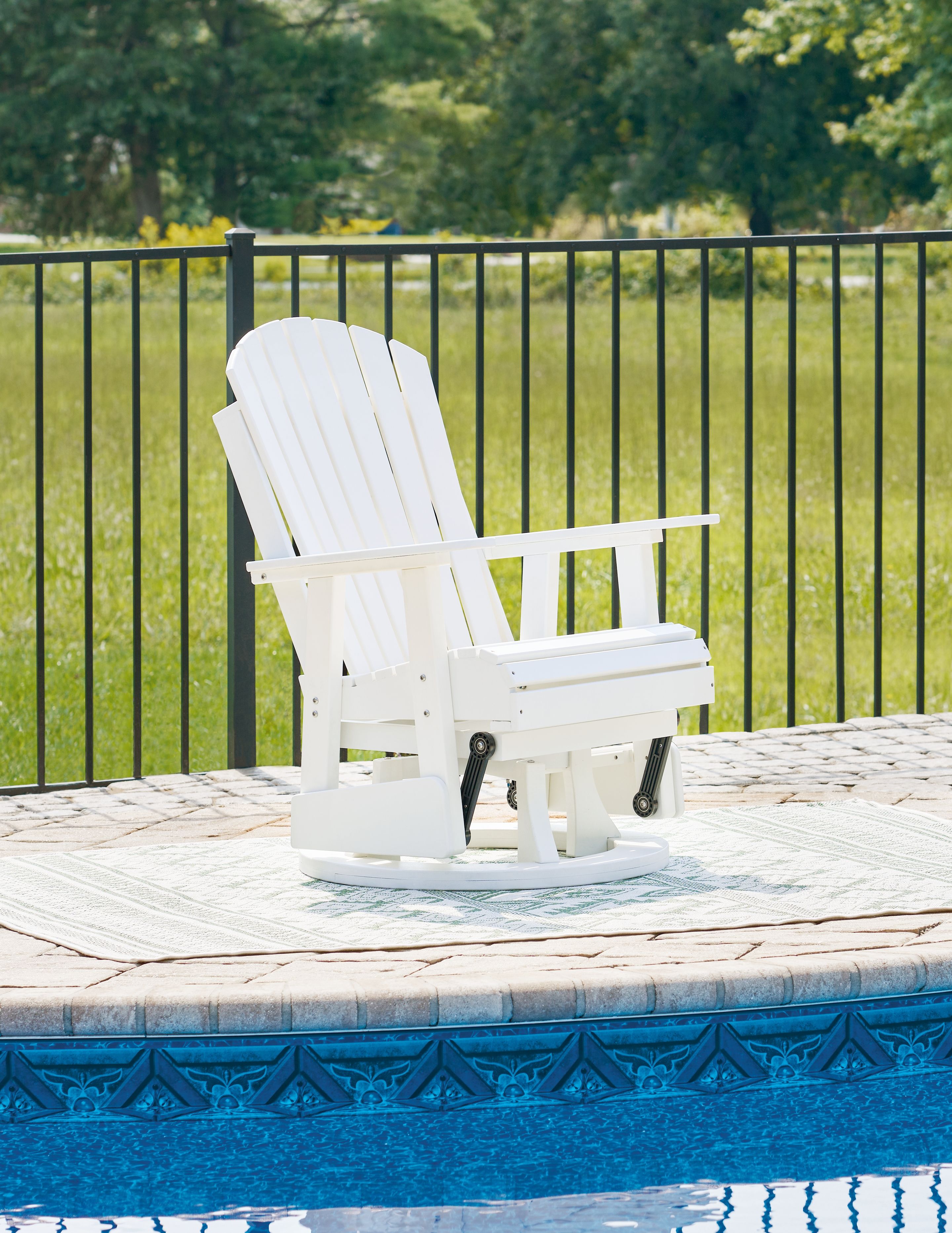 White swivel glider chair with vertical slat back, armrests, and circular gliding base.