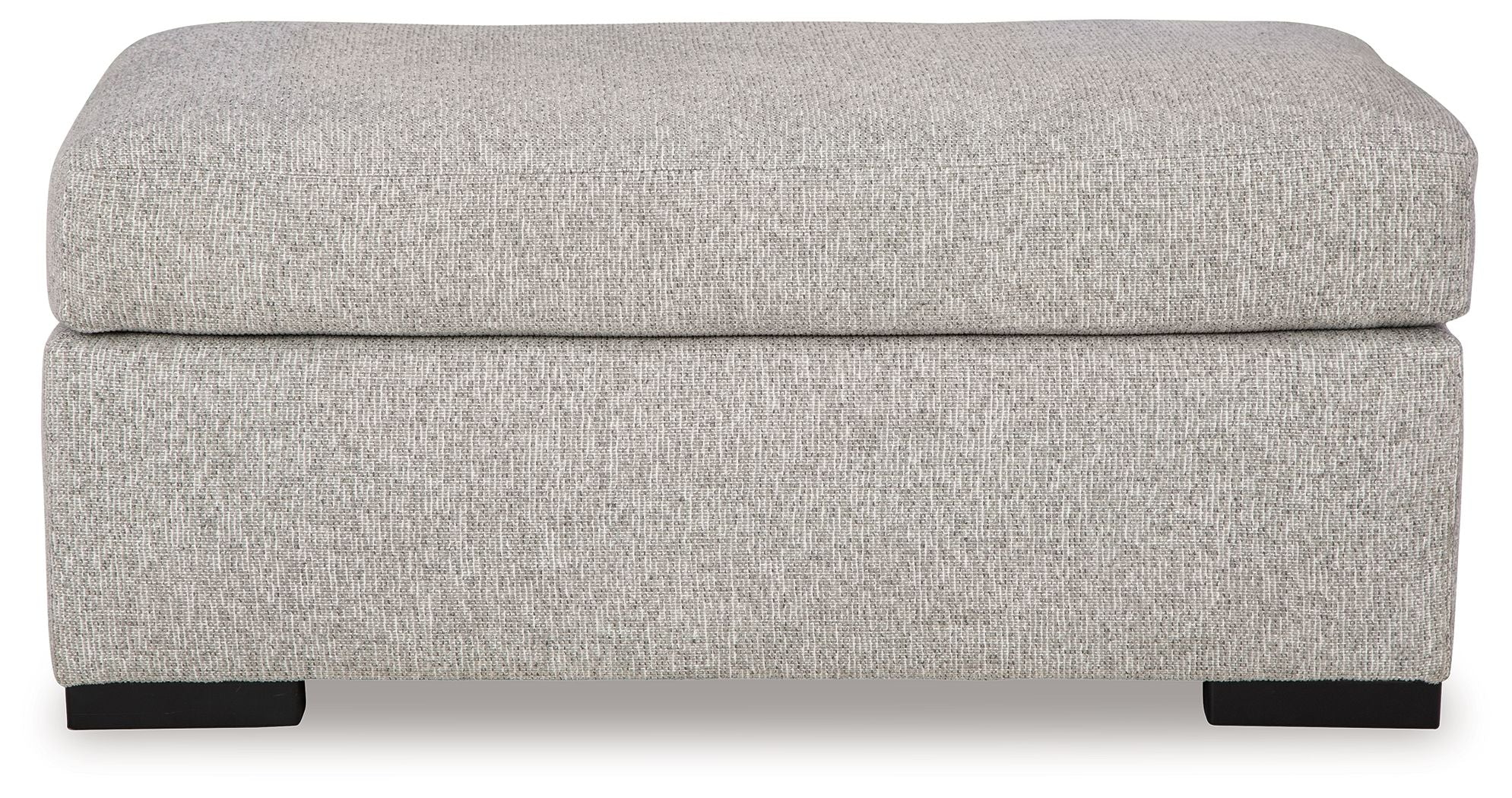 Light gray upholstered ottoman with rounded cushioned top and dark legs