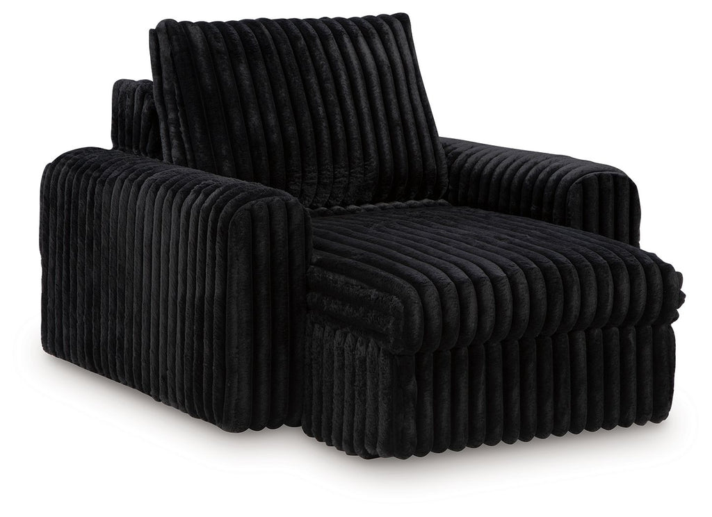 Onyx corduroy power gliding chaise with rounded arms and raised backrest.