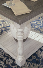 Gray-brown rectangular end table with whitewash turned legs and lower shelf