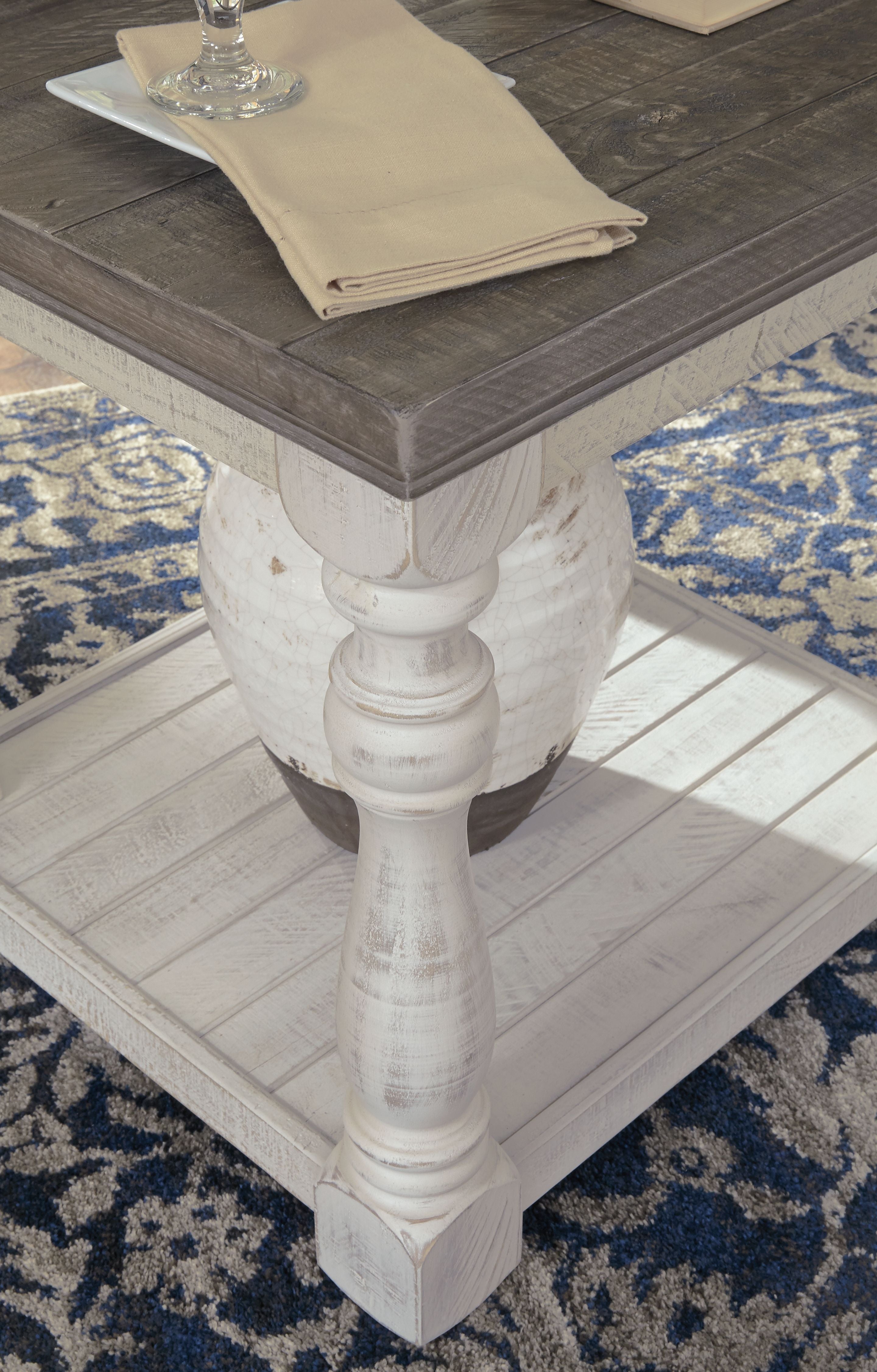 Gray-brown rectangular end table with whitewash turned legs and lower shelf