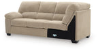 Corner-wedge upholstered sofa with chaise-style arm, light sand fabric, boxy cushions