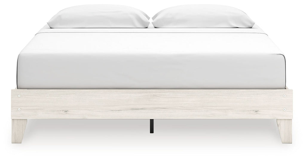 Beige platform bed with white headboard and footboard, front-facing view