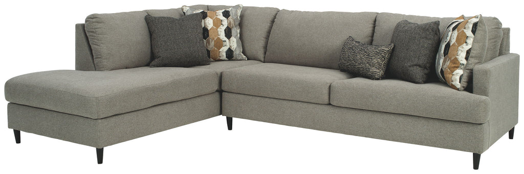 Granite gray fabric sectional sofa with chaise and plush seat cushions, decorative pillows