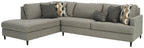 Granite gray fabric sectional sofa with chaise and plush seat cushions, decorative pillows