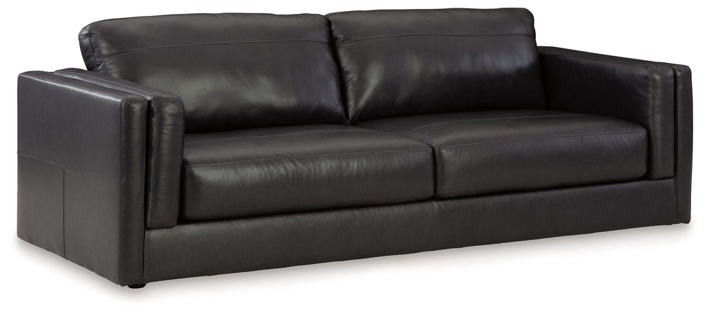Dark leather sofa with three back cushions and square arms