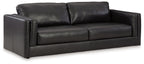 Dark leather sofa with three back cushions and square arms