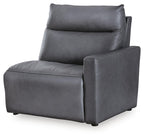 Dark blue power recliner with wide armrests and tufted back cushions