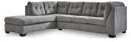 Dark gray L-shaped sectional sleeper sofa with deep tufted cushions and chaise end