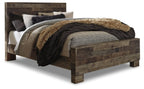 Dark gray panel bed with fur throw and layered bedding, side view with foot board