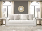 Hartside sofa in off-white fabric with three striped pillows and dark wood legs