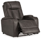 Dark power recliner shown reclined with adjustable headrest and padded footrest