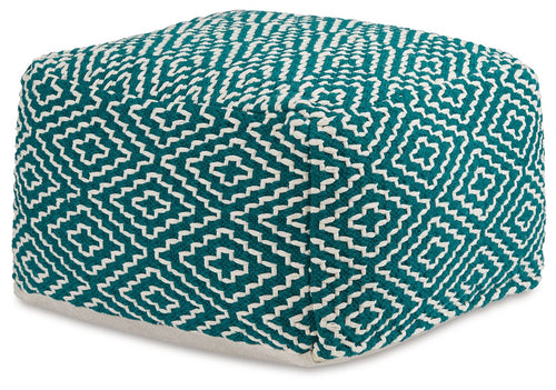 Teal and ivory patterned fabric pouf with geometric cross design, rounded cube shape.