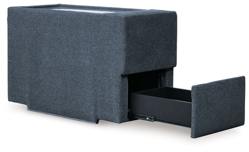 Dark blue fabric console with storage, open side reveals storage bin