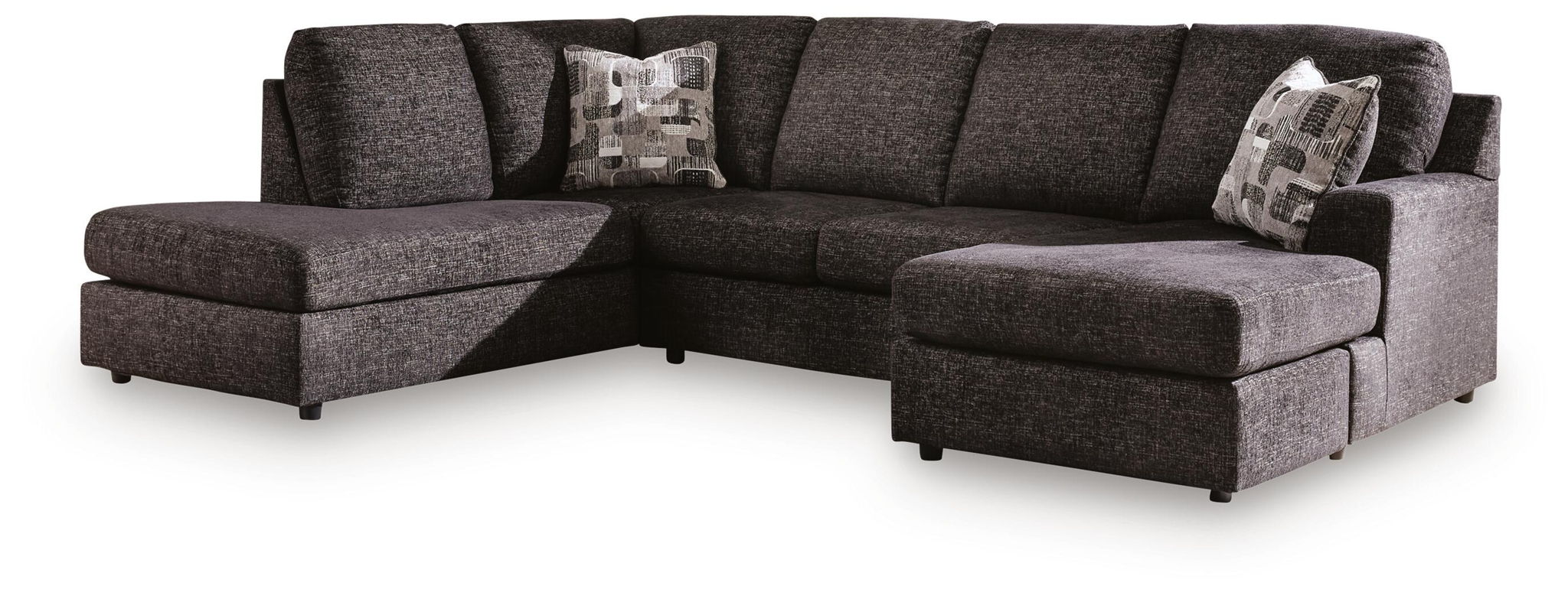 Dark charcoal fabric sectional sofa with chaise, padded arms, and three accent pillows