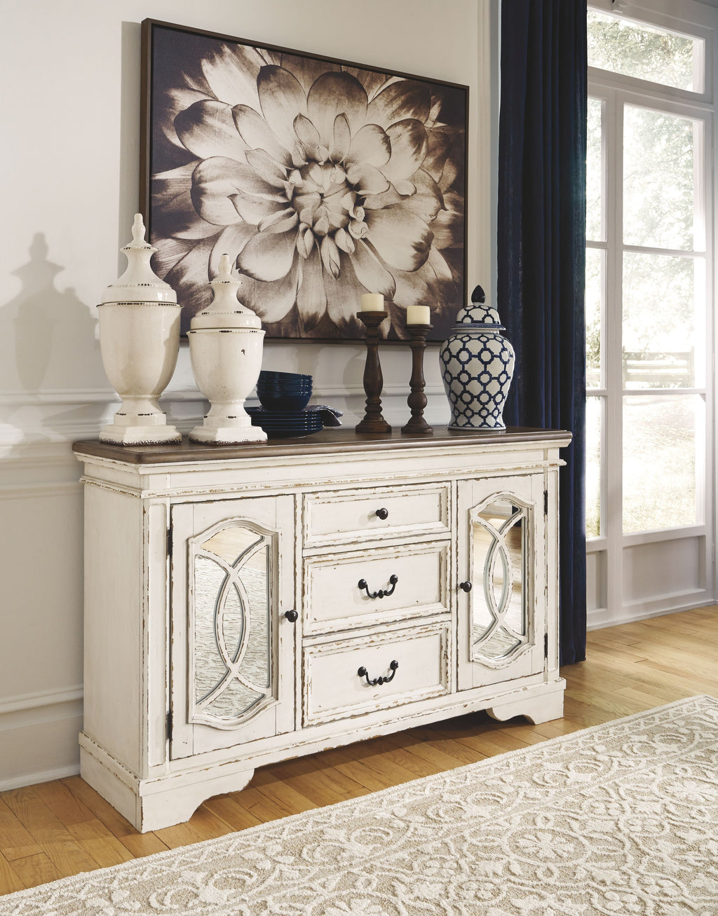 Chipped white server cabinet with arched glass doors and stacked drawers