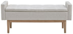 Upholstered storage bench with padded seat and beige fabric, wooden legs