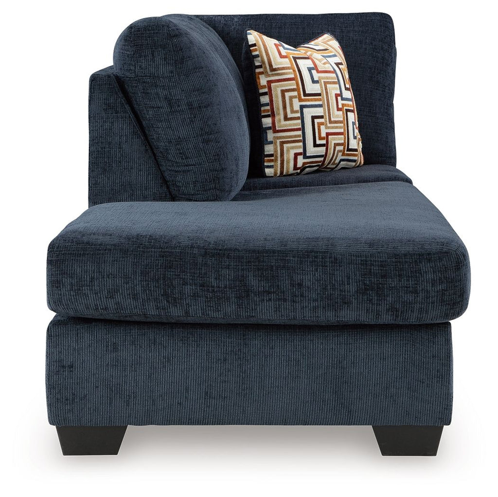 Aviemore dark ink chaise lounge with rounded arm, seat cushion, and geometric throw pillow