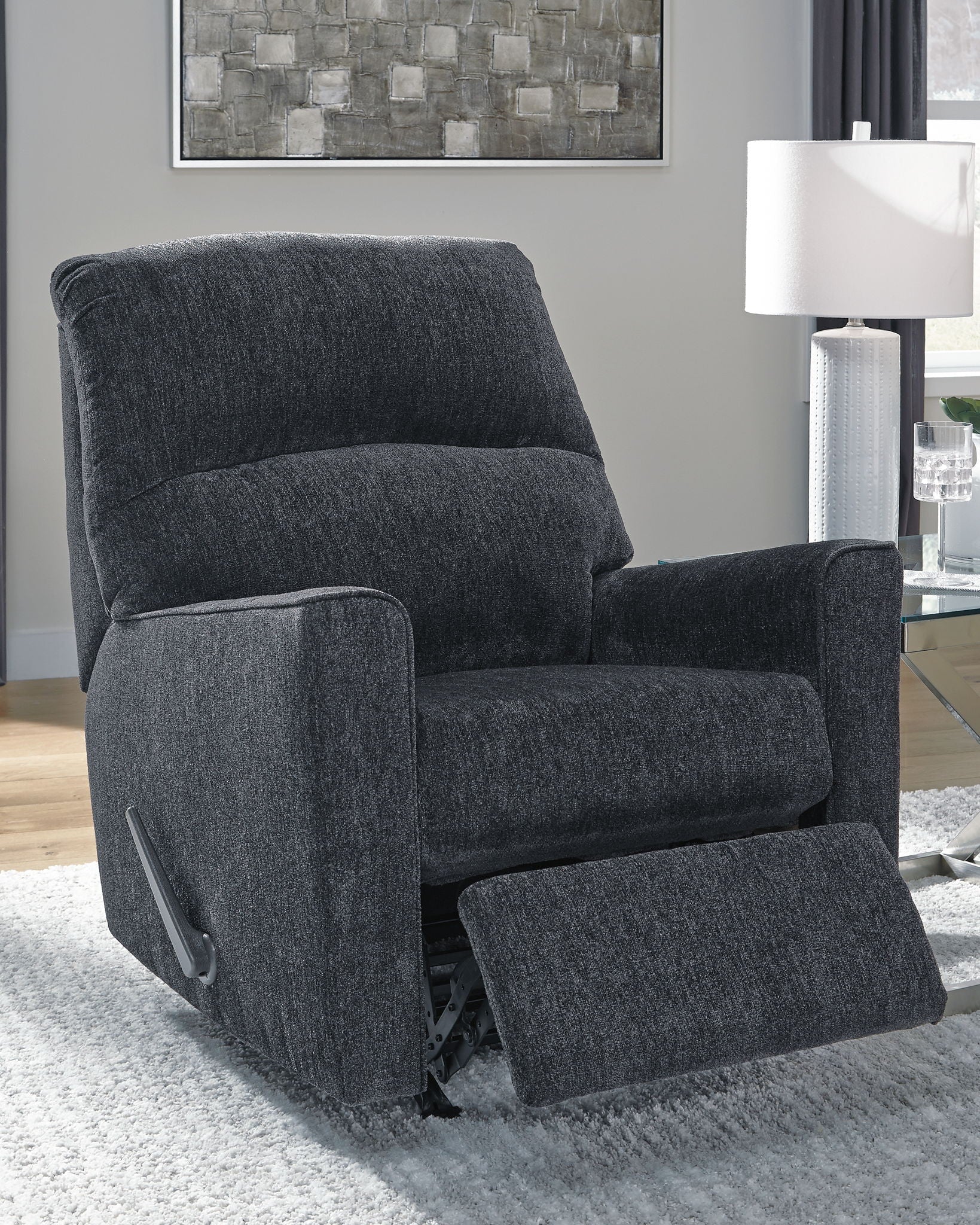 Altari slate rocker recliner, upright position with wide padded arms and recline lever