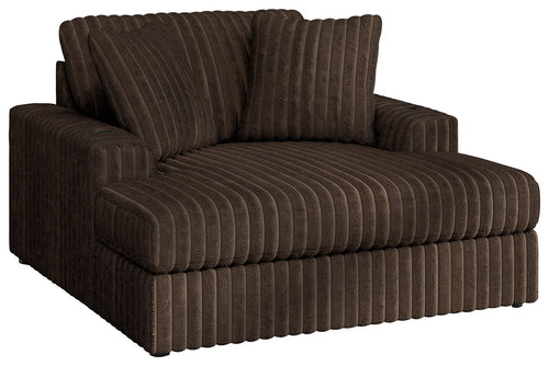 Oversized chaise with ribbed dark brown fabric, low arms and thick contoured seat.