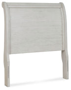 Twin sleigh headboard in antique white with tall arched top and vertical paneling