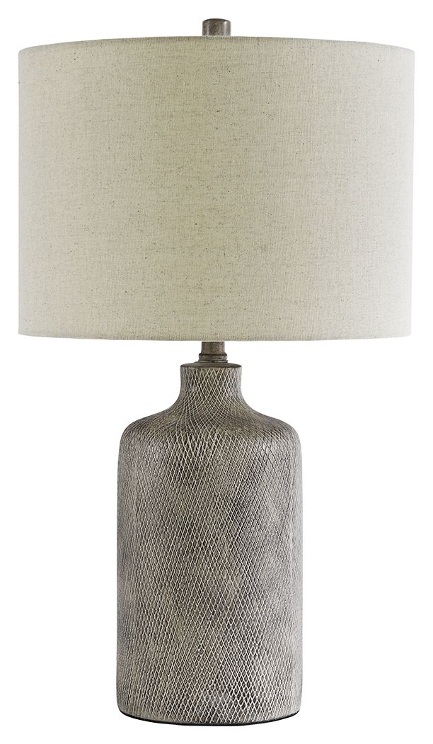 Ceramic table lamp with off-white fabric shade and textured dark base