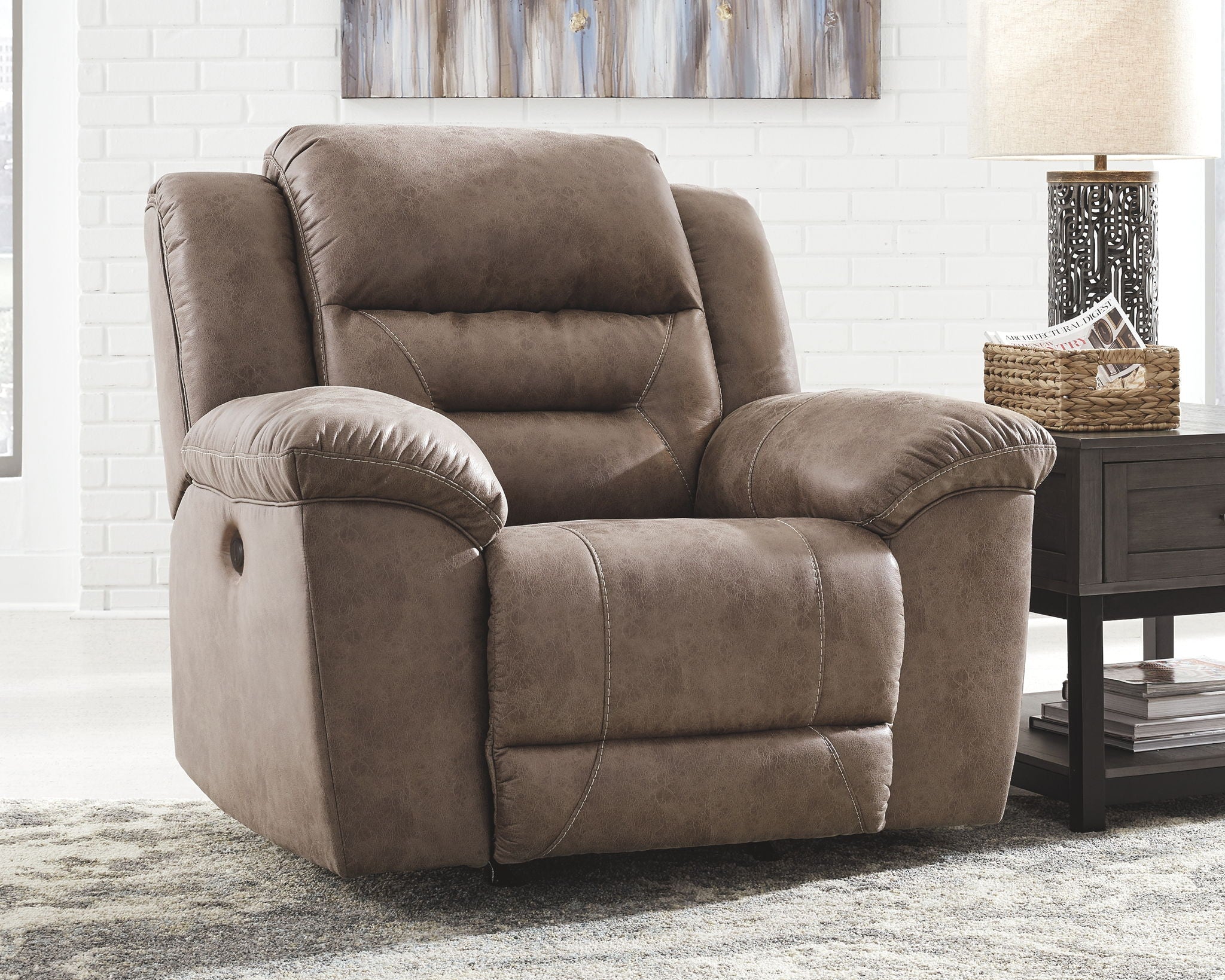 Fossil power recliner with reclining back and raised footrest, taupe fabric upholstery