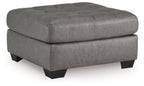 Oversized accent ottoman in gray with tufted top and black legs