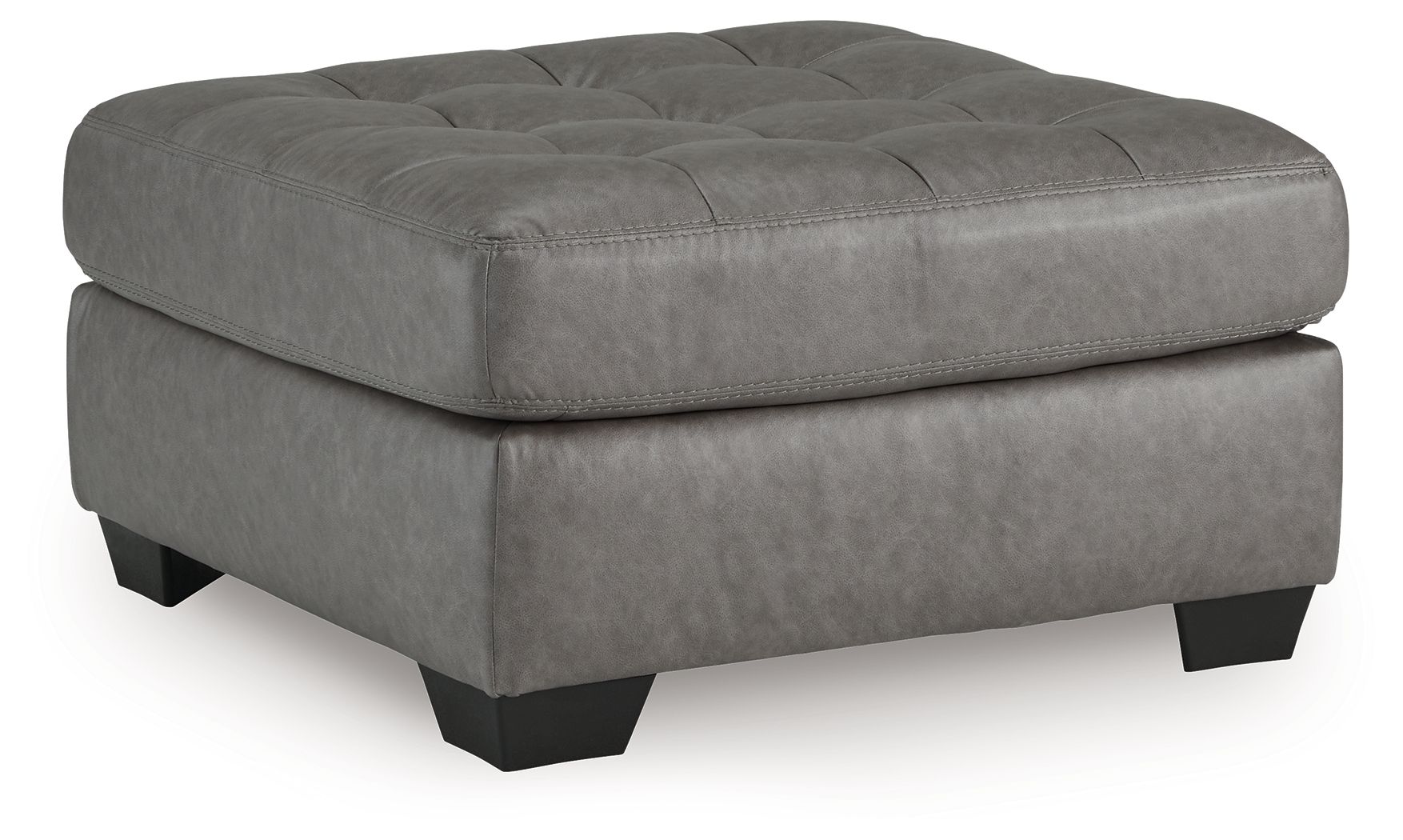 Oversized accent ottoman in gray with tufted top and black legs