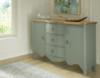 Antique green accent cabinet with wood top and three drawers, brass pulls