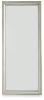 Champagne full-length floor mirror with slim metal frame and stand supports.
