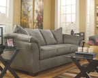 Living room set with gray sectional sofa, plush cushions and curved armrests