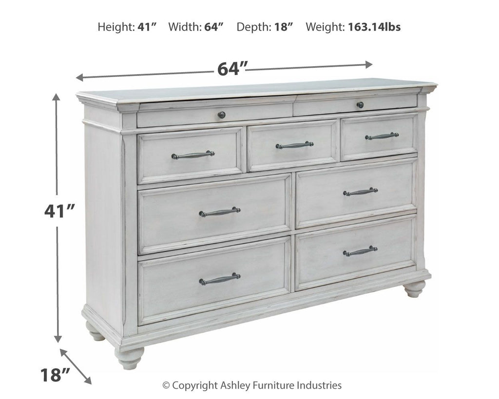 Whitewash dresser with six drawers, metal bar pulls, and turned legs