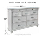 Whitewash dresser with six drawers, metal bar pulls, and turned legs