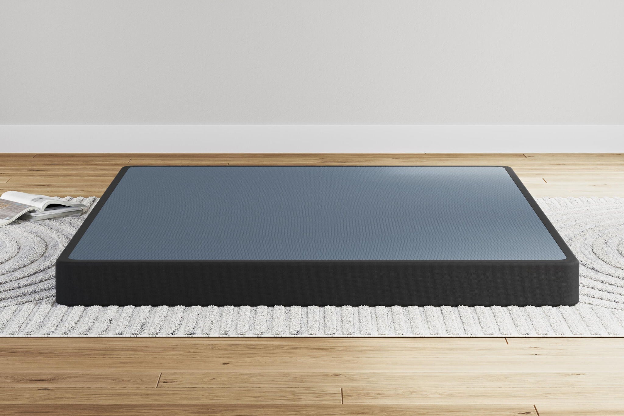 Low-profile foundation mattress with blue-gray top and black base