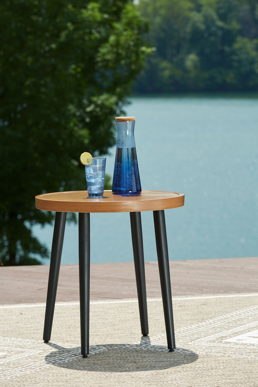 Round end table with round wood top and dark tapered legs