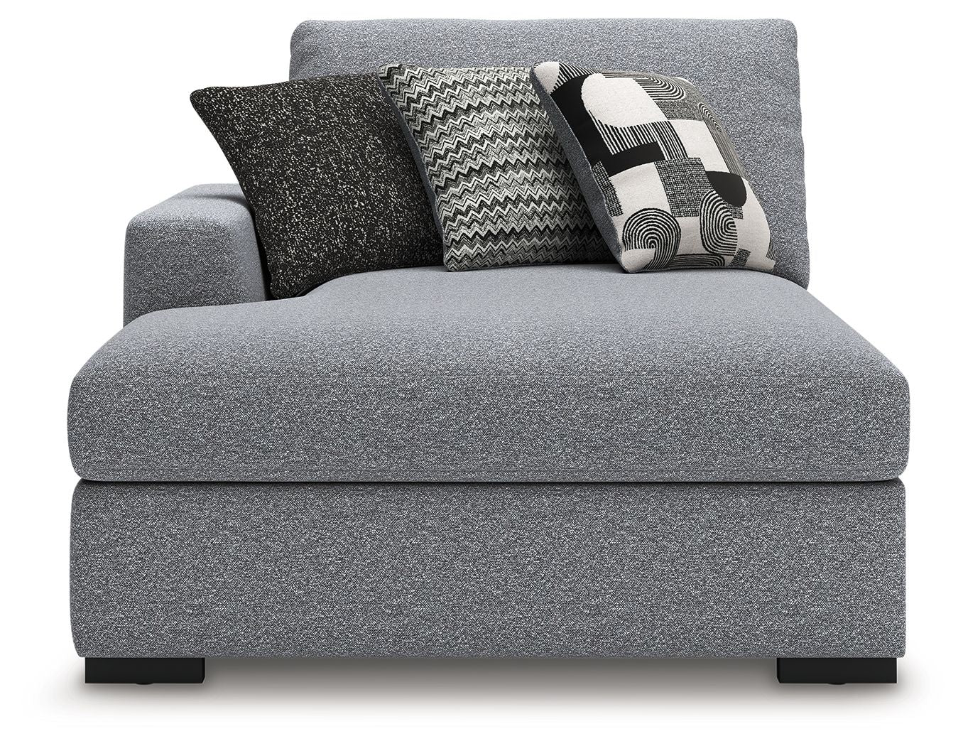 Grey upholstered chaise with back cushions and decorative throw pillows