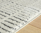 Turinwith rug detail, textured beige pile with black stripe bands