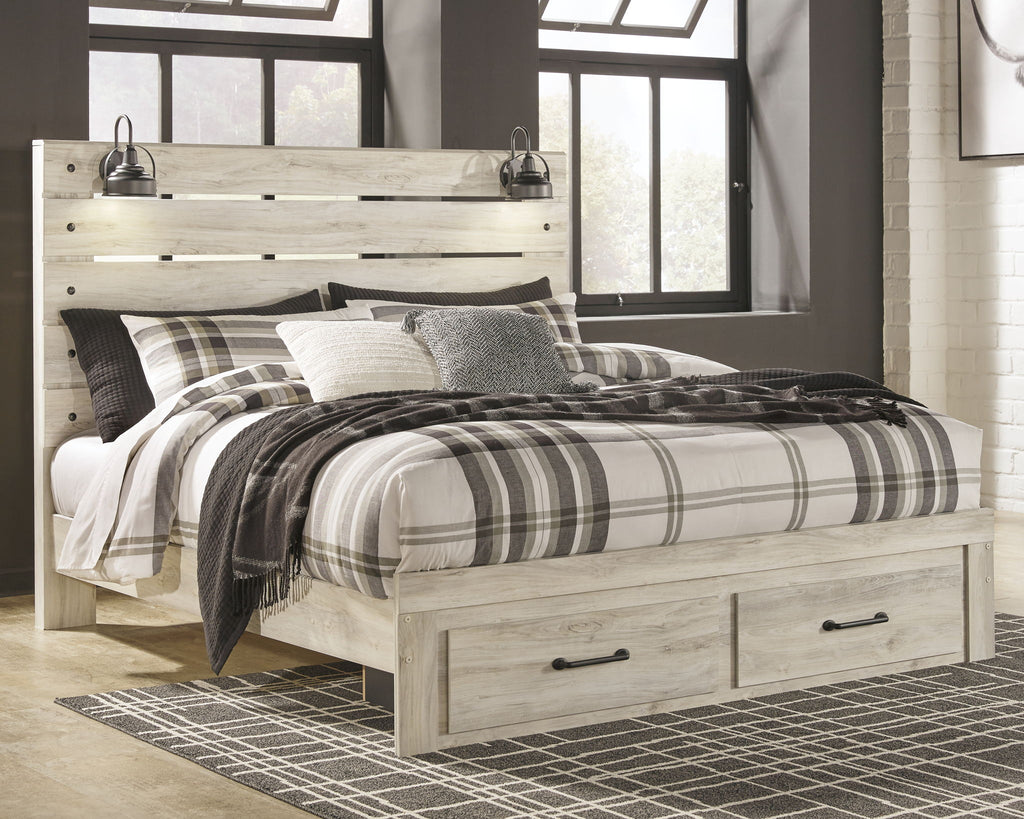 Cambeck panel bed with slatted headboard, beige wood, plaid bedding and pillows.