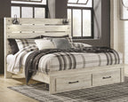 Cambeck panel bed with slatted headboard, beige wood, plaid bedding and pillows.