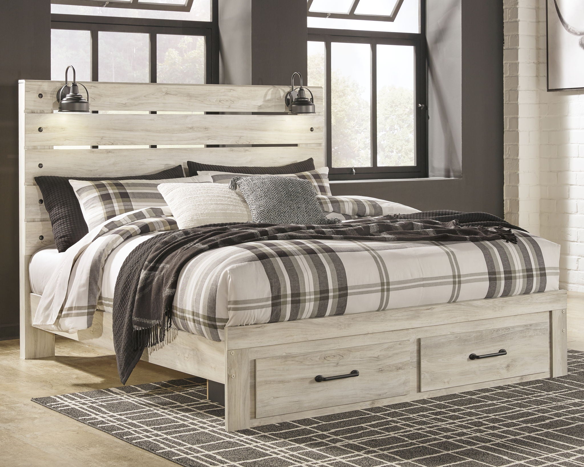 Cambeck panel bed with slatted headboard, beige wood, plaid bedding and pillows.