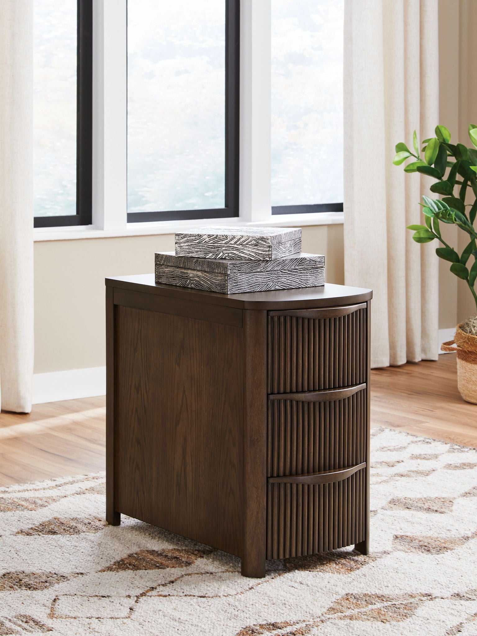 Dark brown chair side end table with three vertical slat drawers and a flat top