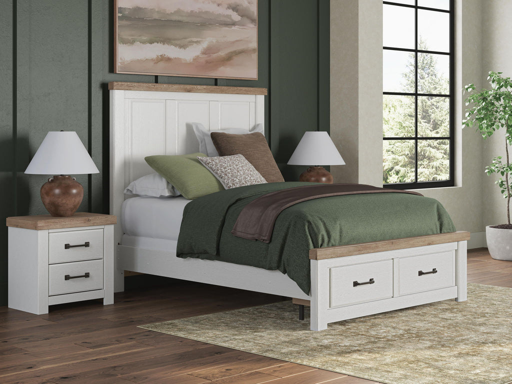 White panel storage bed with two under-bed drawers and wood-trim accents