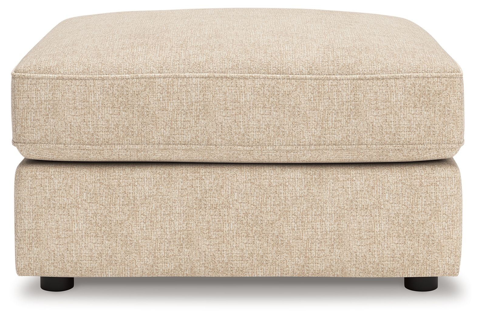 Sand fabric ottoman with low rectangular base, smooth top, and dark legs
