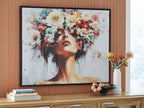 Framed wall art print with stylized woman's face and colorful floral collage, multi-color