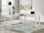 White corner home office desk with drawers, open shelf, and built-in cord cutouts