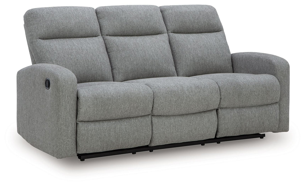 Light gray reclining sofa with three back cushions, padded arms and black base