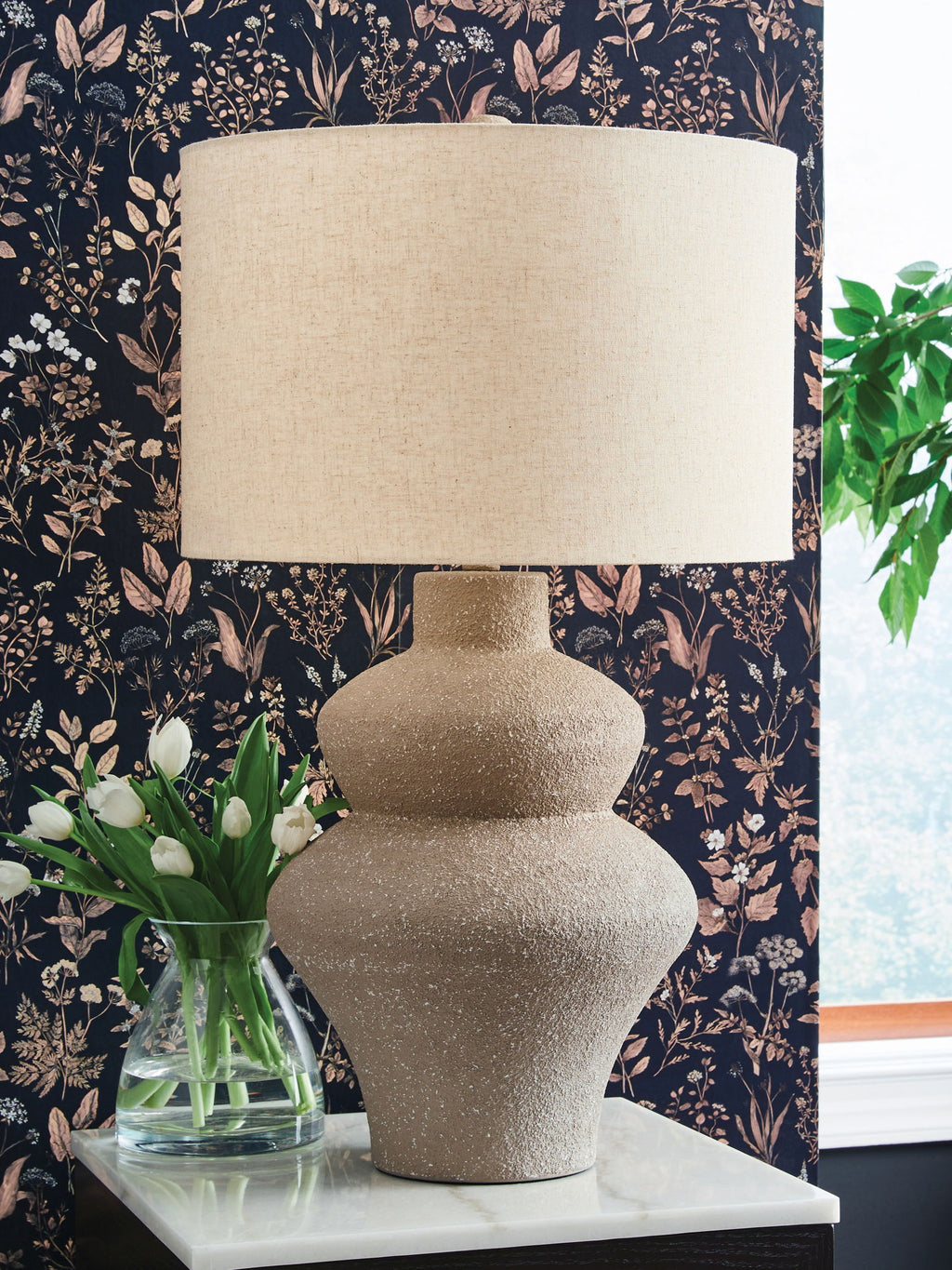 Beige metal table lamp, textured urn-style base with beige drum fabric shade